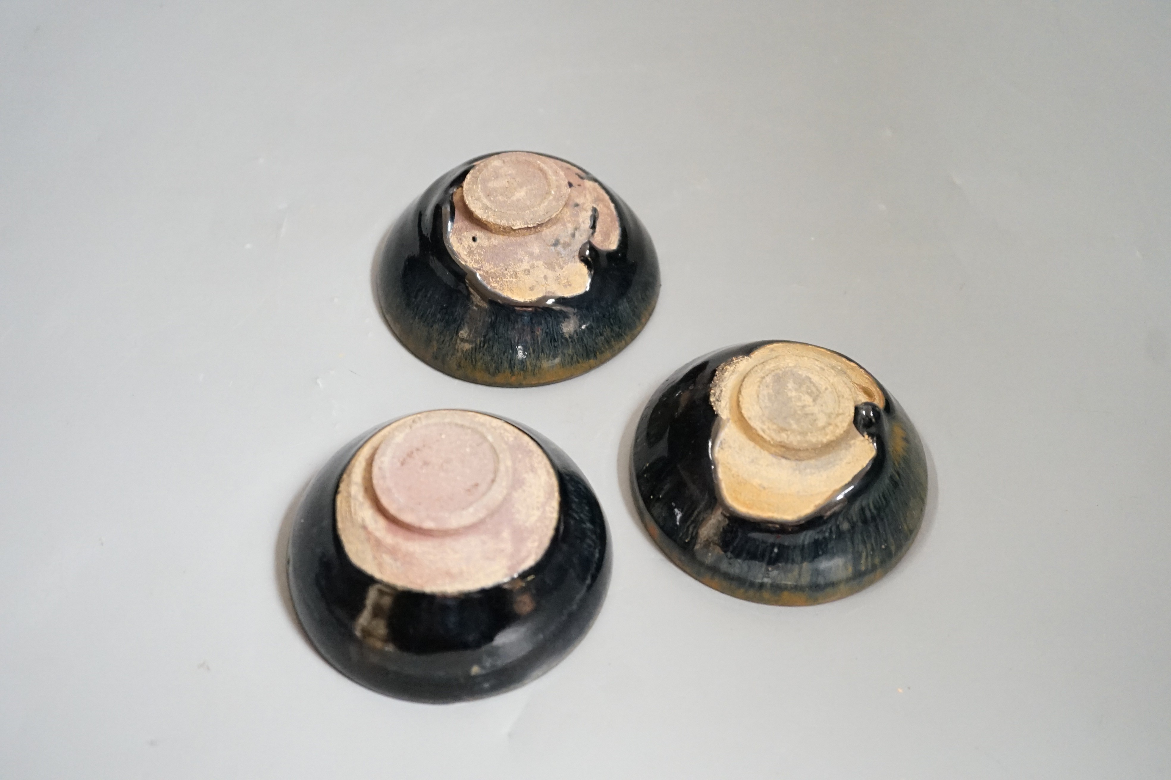 Three Chinese Jian type hare's fur bowls, 9cms diameter